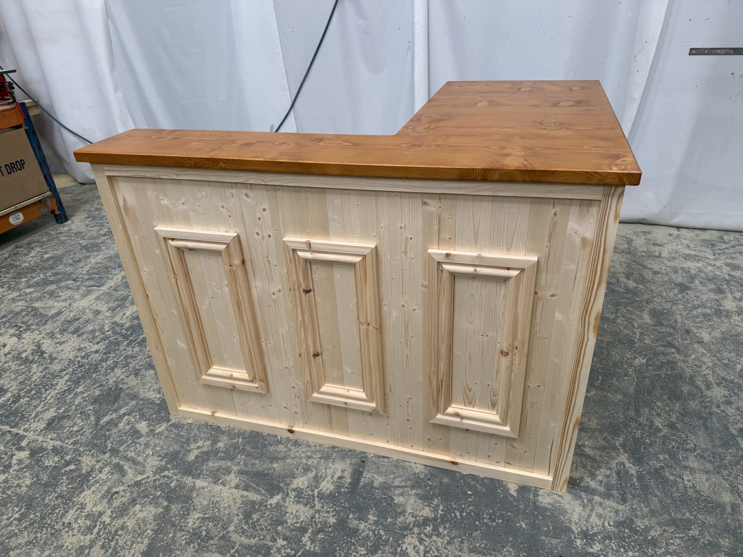 Luxe Satin natural wood home bar integrated into modern home space, warm timber tones highlighted by ambient light, spacious serving top ready for entertaining