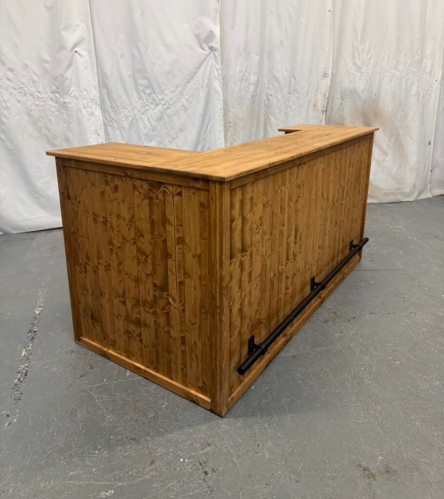 large corner bar with black foot rail and fridge compartment in satin shade
